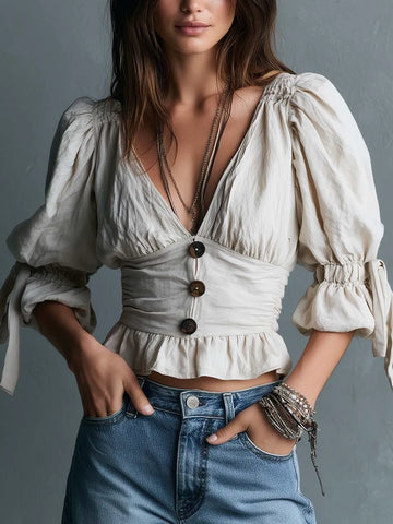 Chemisier péplum bohème en coton à décolleté plongeant, boutons et manches bouffantes