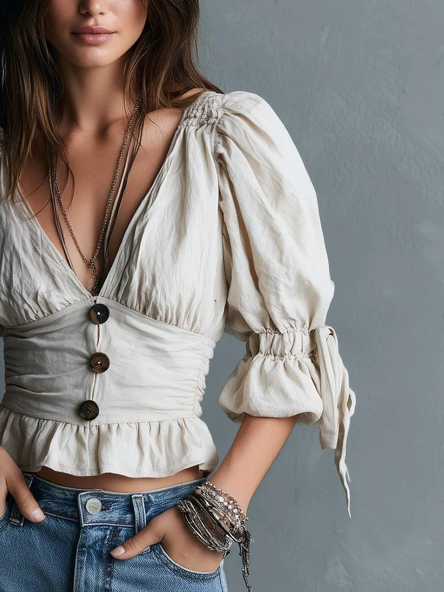 Chemisier péplum bohème en coton à décolleté plongeant, boutons et manches bouffantes