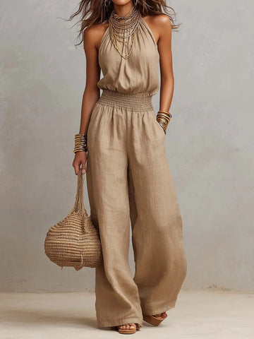Combinaison-pantalon large en lin et coton beige, avec encolure dos nu et taille smockée