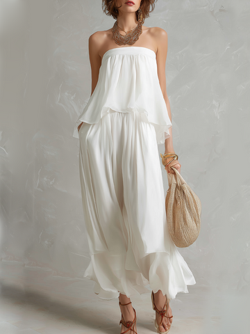 Tuta pantalone bohémien di chiffon bianco senza spalline