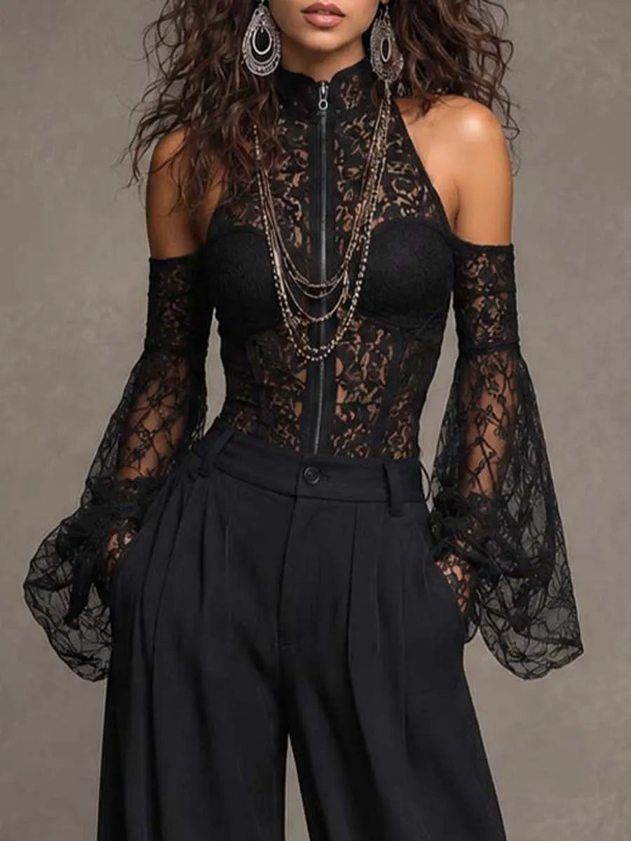 Combinaison décolletée aux épaules avec manches cloches, fermeture éclair intégrale, col montant, corset en dentelle à la taille et jambes larges